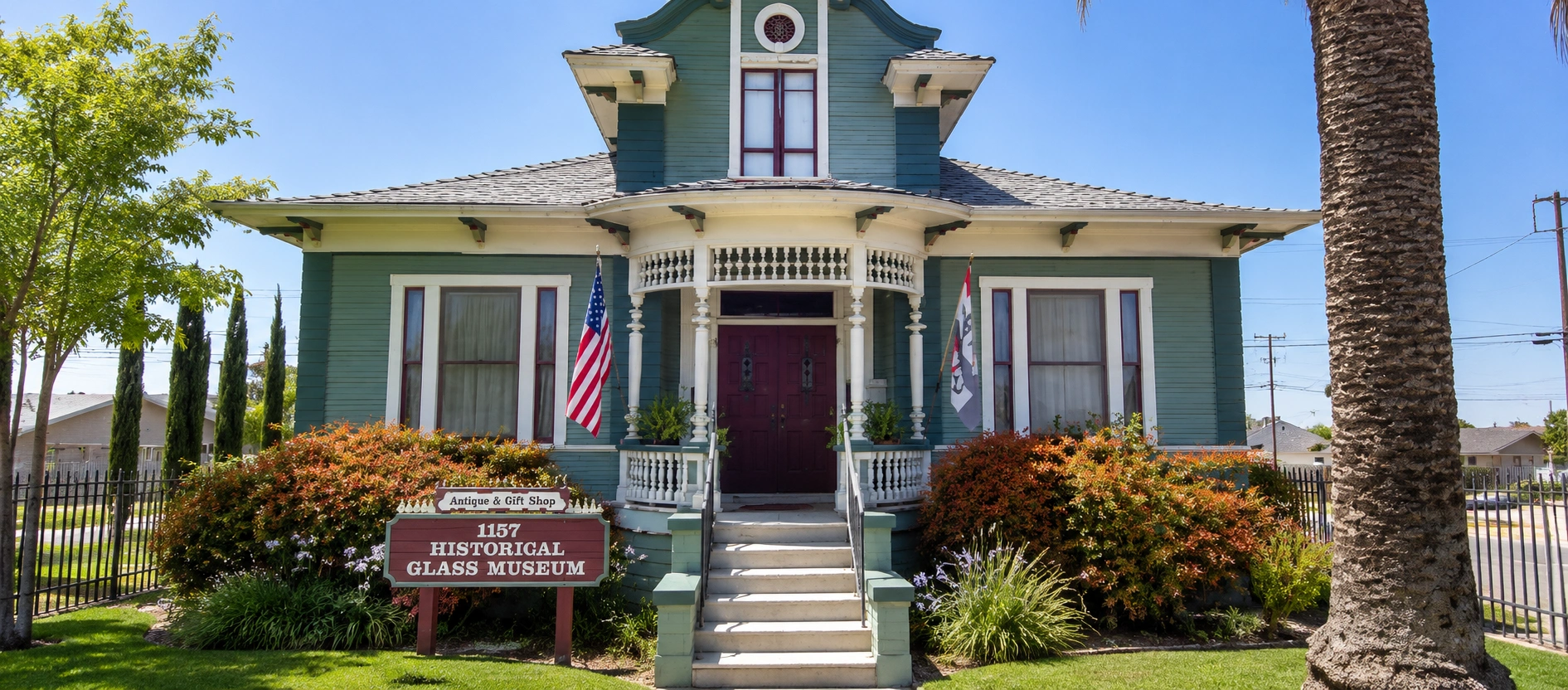 Historical Glass Museum in Redlands California with Victorian architecture and landscaped museum entrance