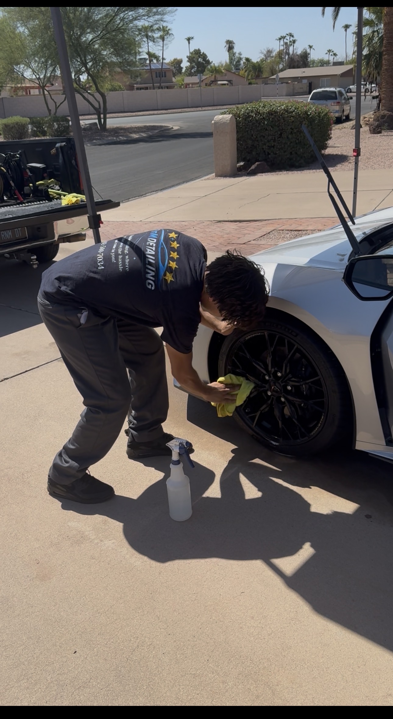 RnM Detailing team member detailing a wheel