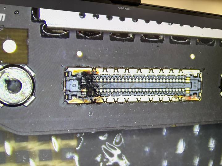 Burnt board connector under the microscope