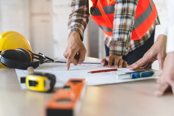Contractors reviewing building plans