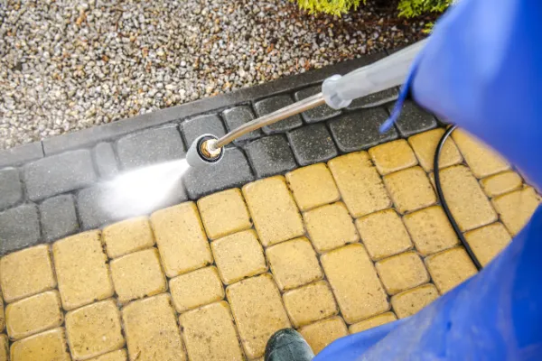 Pressure washing a driveway