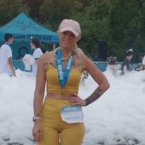 Rachael R. with her marathon medal