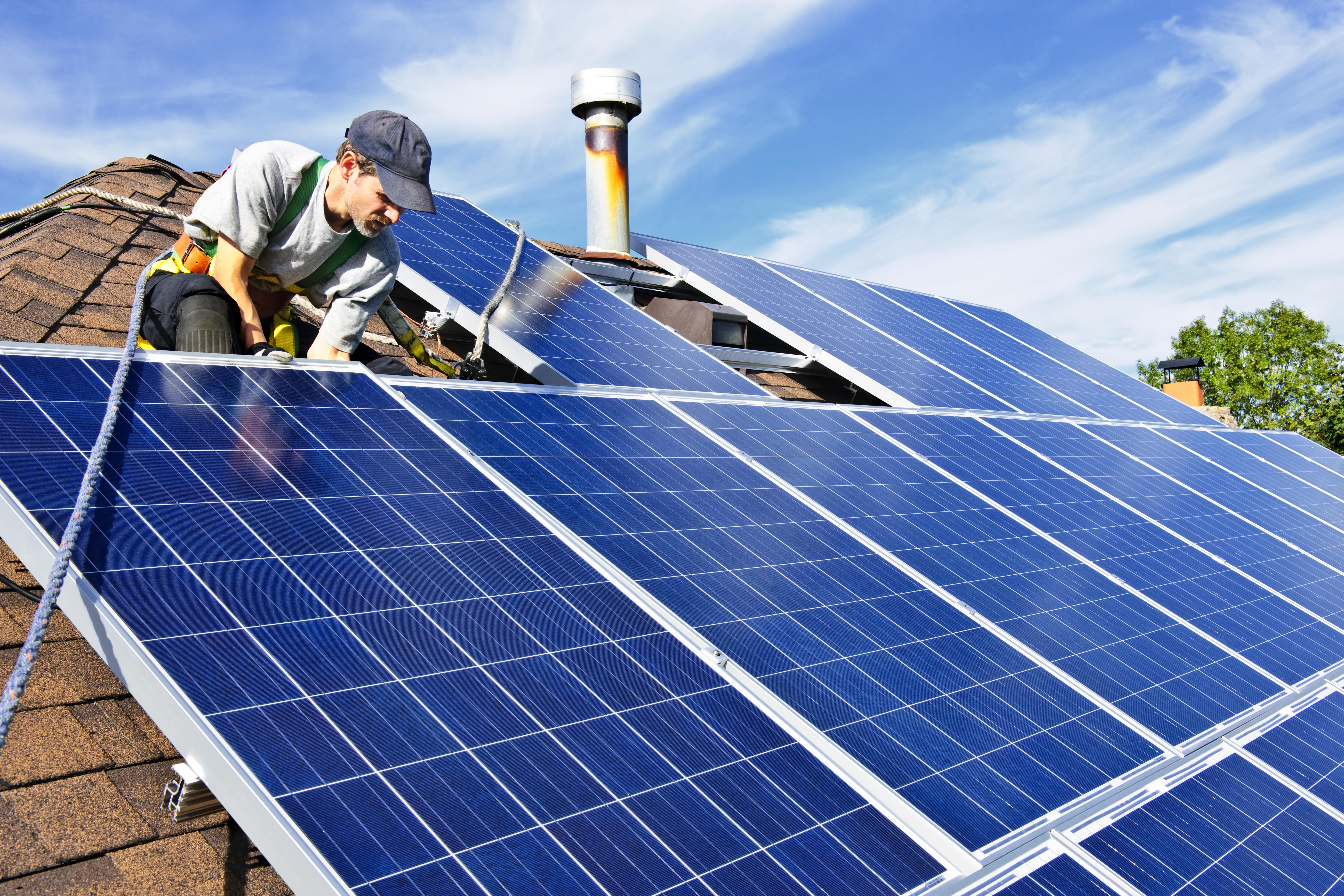 Solar panel expert installing solar panels