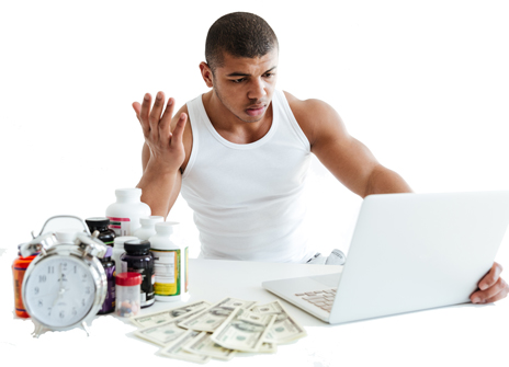 Gym owner reviewing finances on a laptop