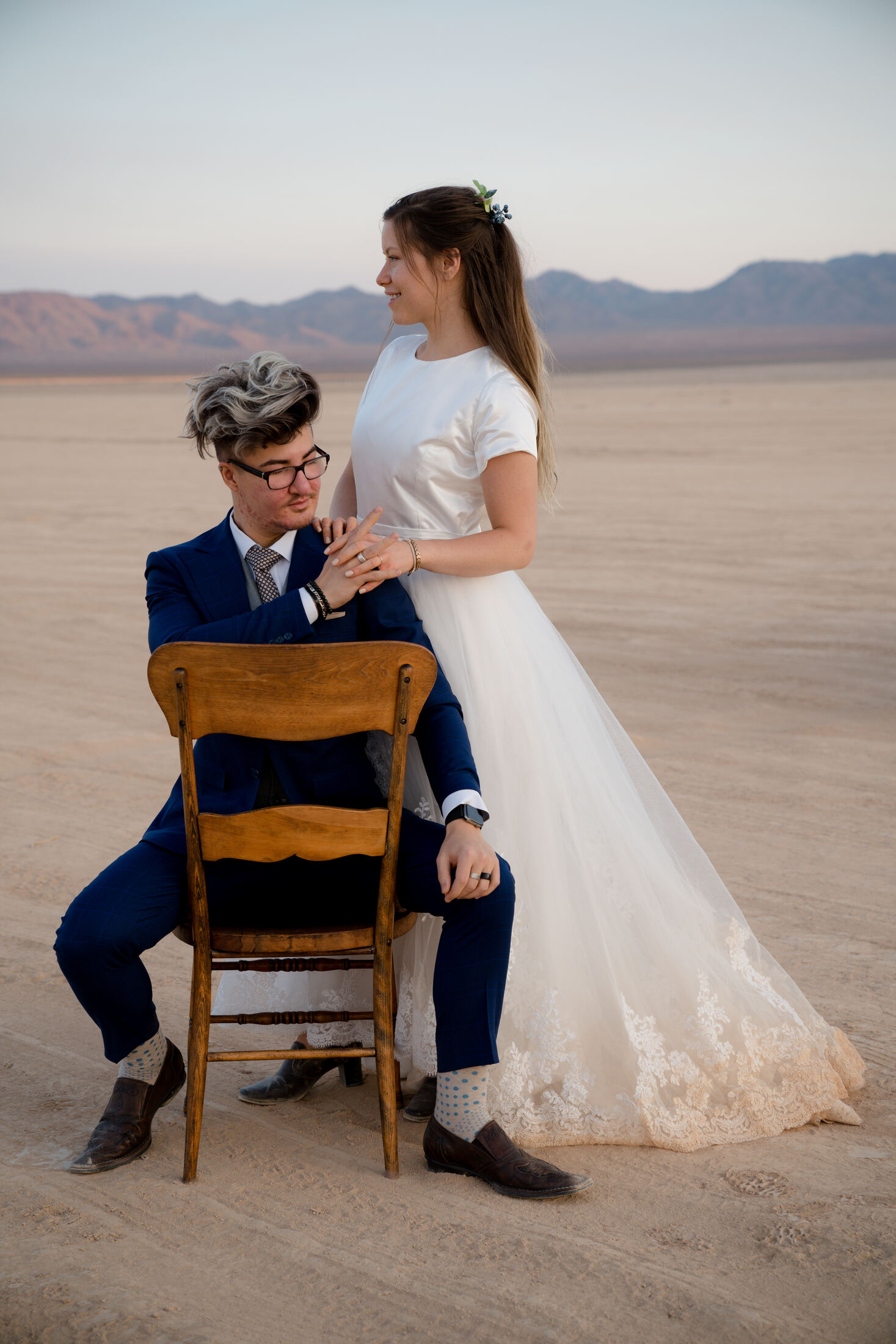 Stylized editorial portrait in the desert at dusk
