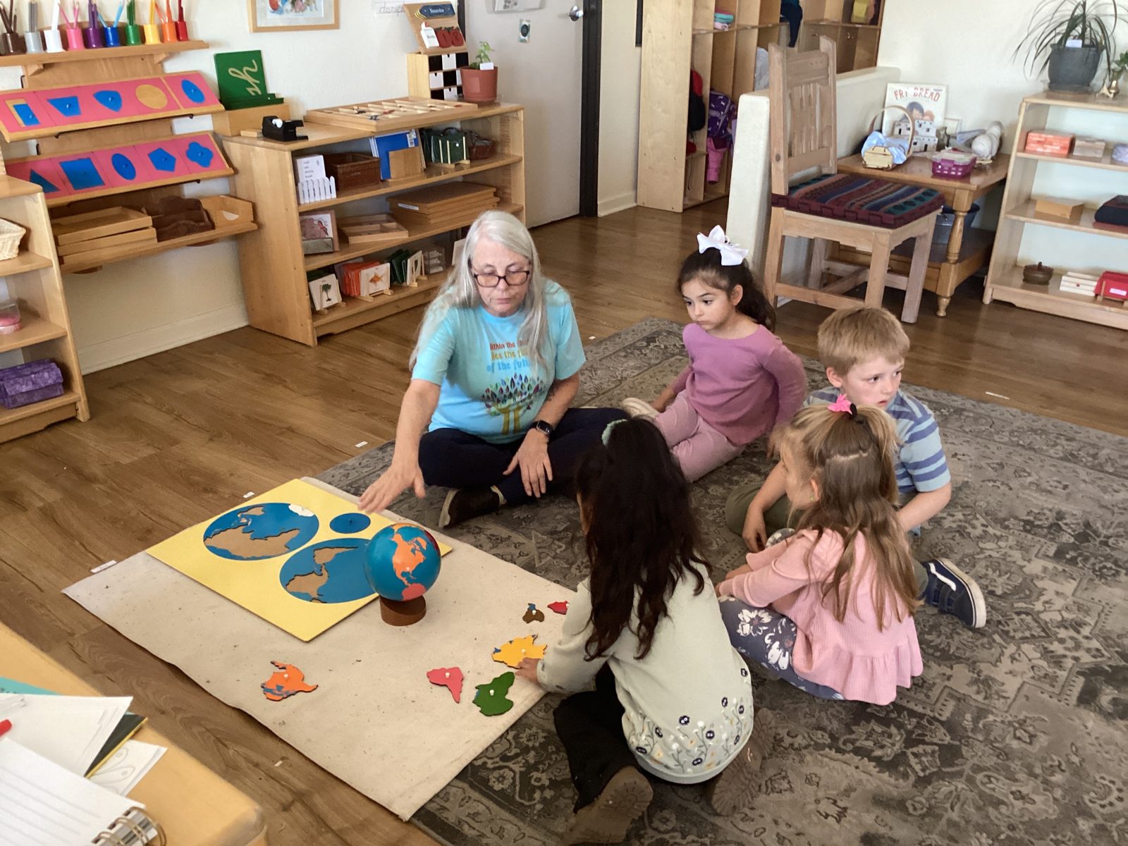 St. Peter's children working with a world map puzzle