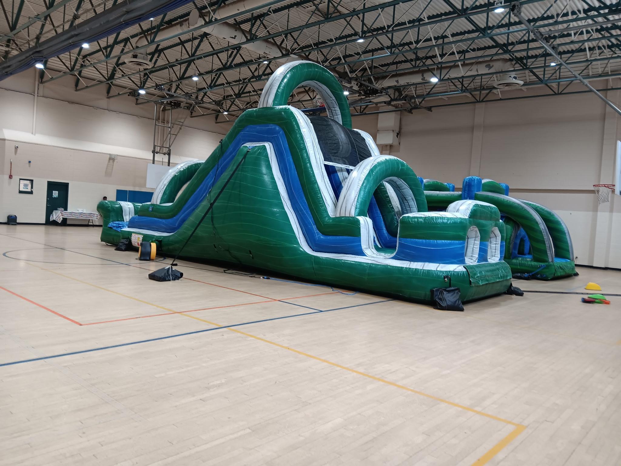 100' Green Emerald Obstacle Course inflatable rental in Germantown, MD from Smiley Jump LLC for school events, church gatherings, birthday parties, and community festivals