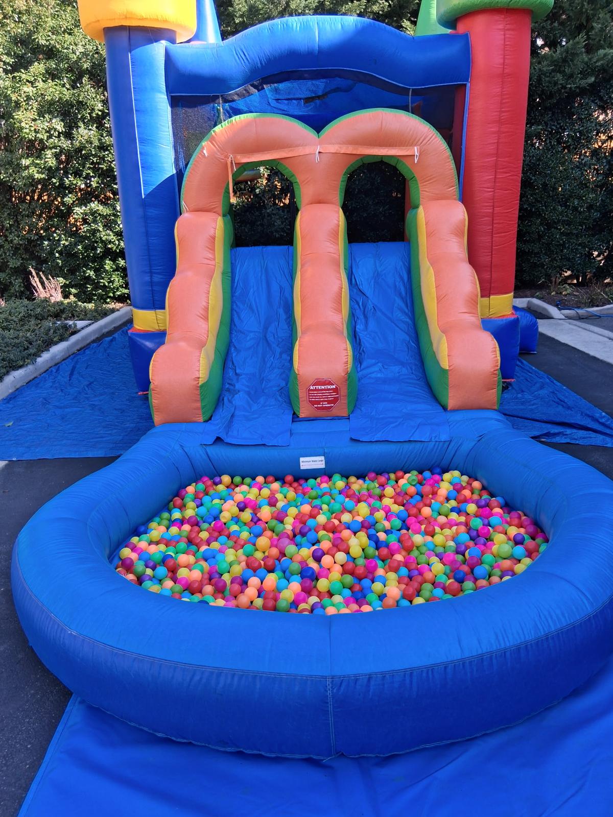 Tropical combo bounce house with slide and ball pit rental from Smiley Jump LLC in Germantown, MD, featuring a colorful inflatable combo for kids parties, school events, and backyard celebrations