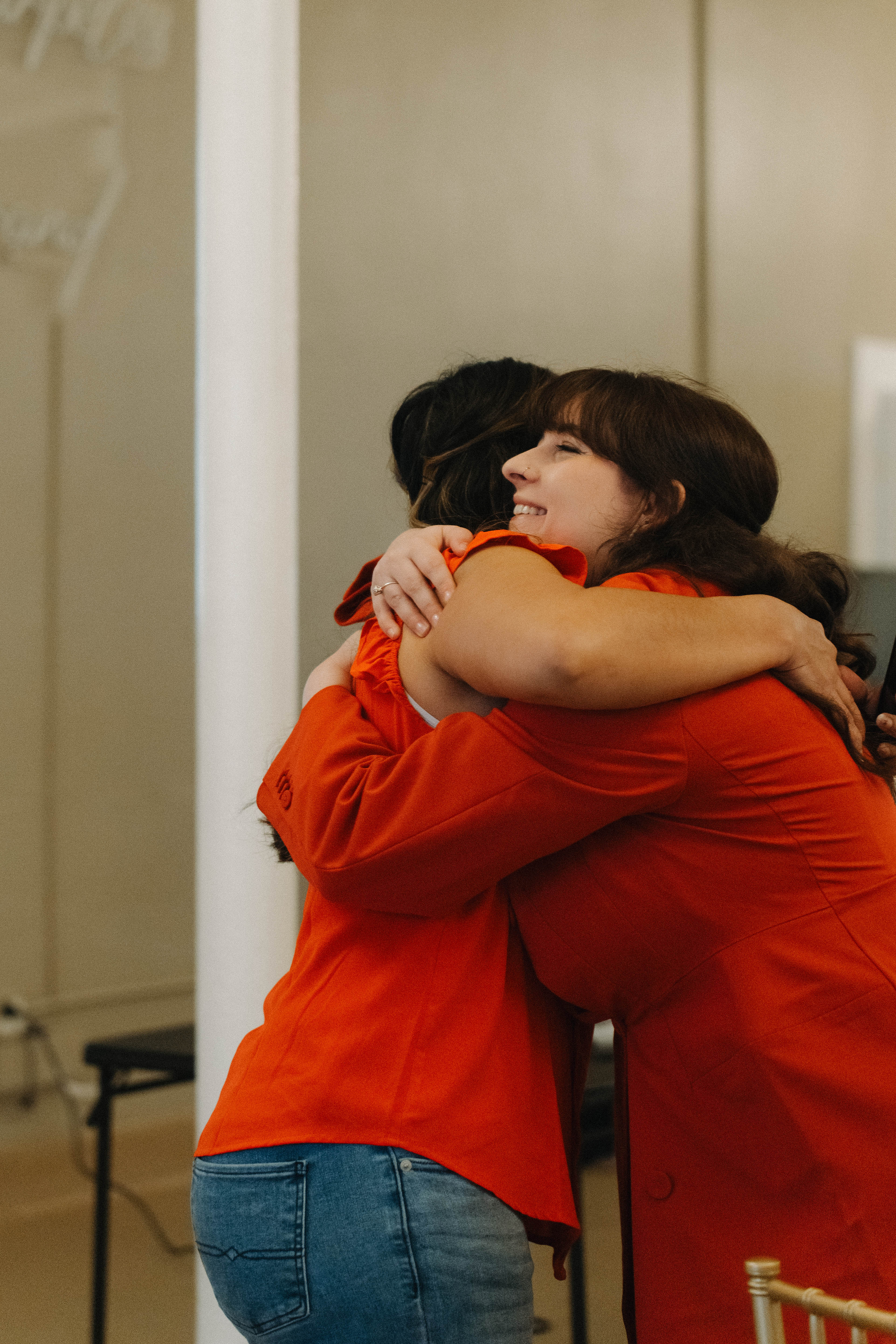Two women greeting each other at a BESTIES event