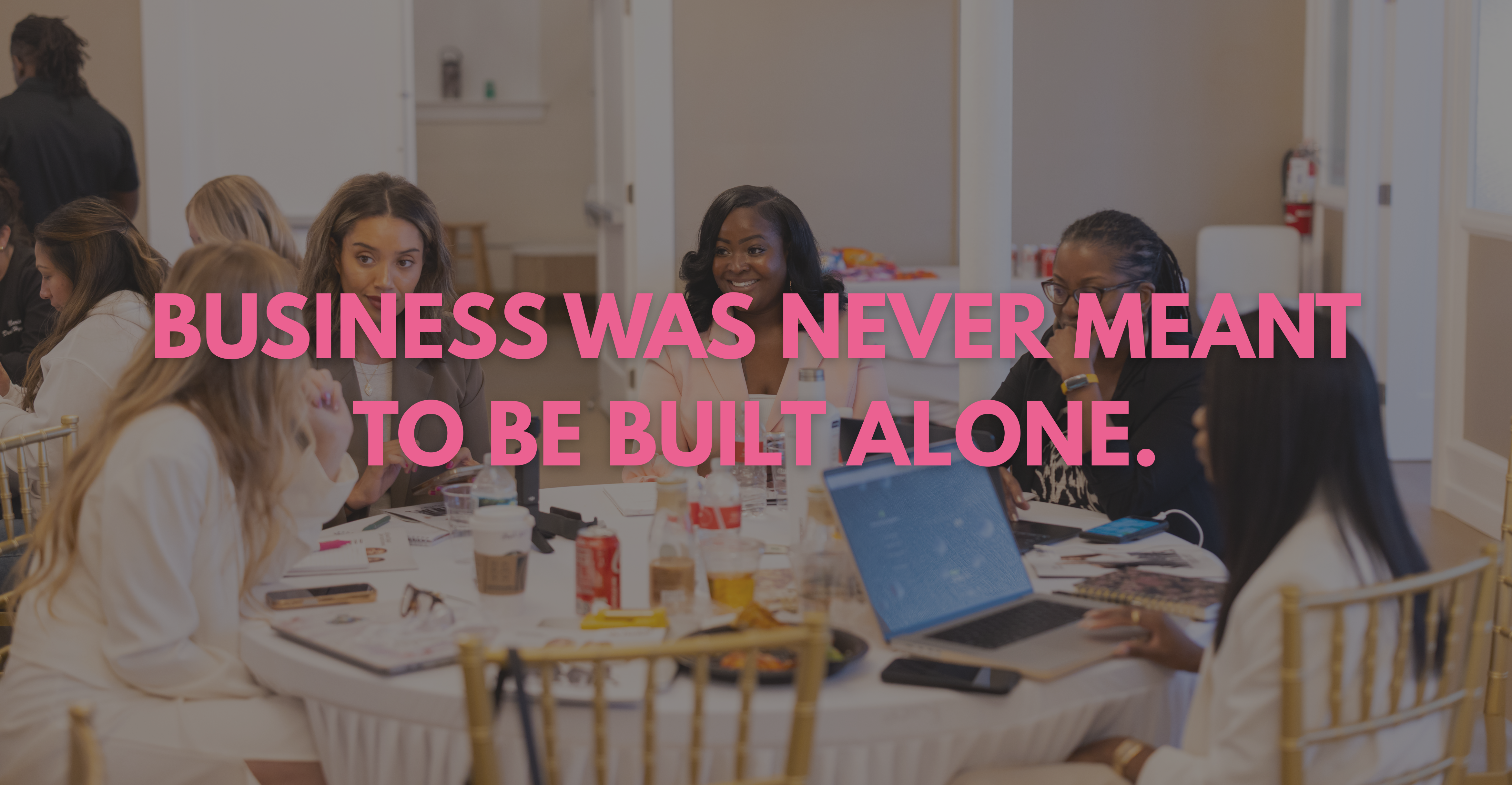 Women building relationships at The BESTIES Boardroom with the words Business was never meant to be built alone