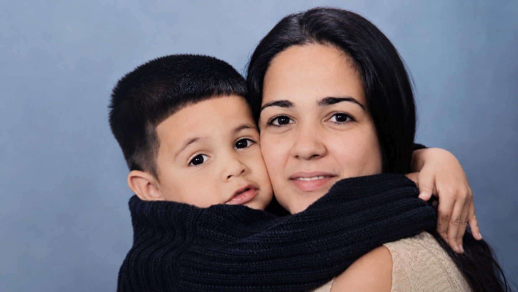 Illustration of three mothers and their children embracing, representing The Home She Deserves community