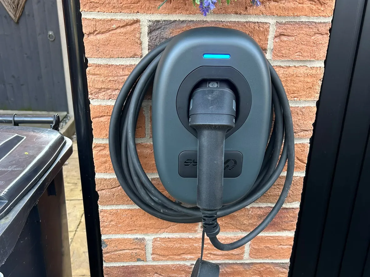 Tethered home EV charger fitted to a brick gate pillar