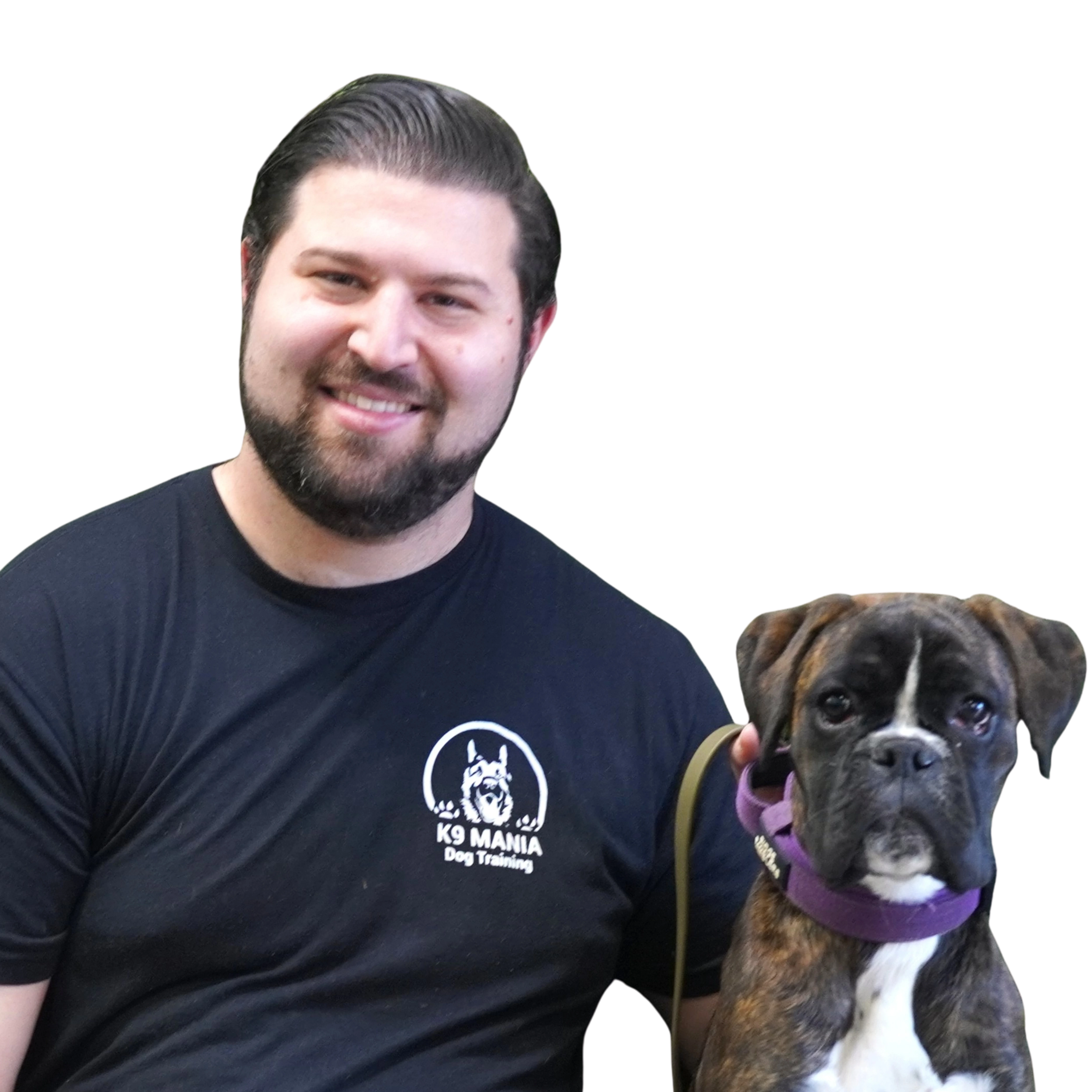 Our Certification 2 Dog trainer at K9 Mania Dog Training holding a dog in Deer Park Long Island