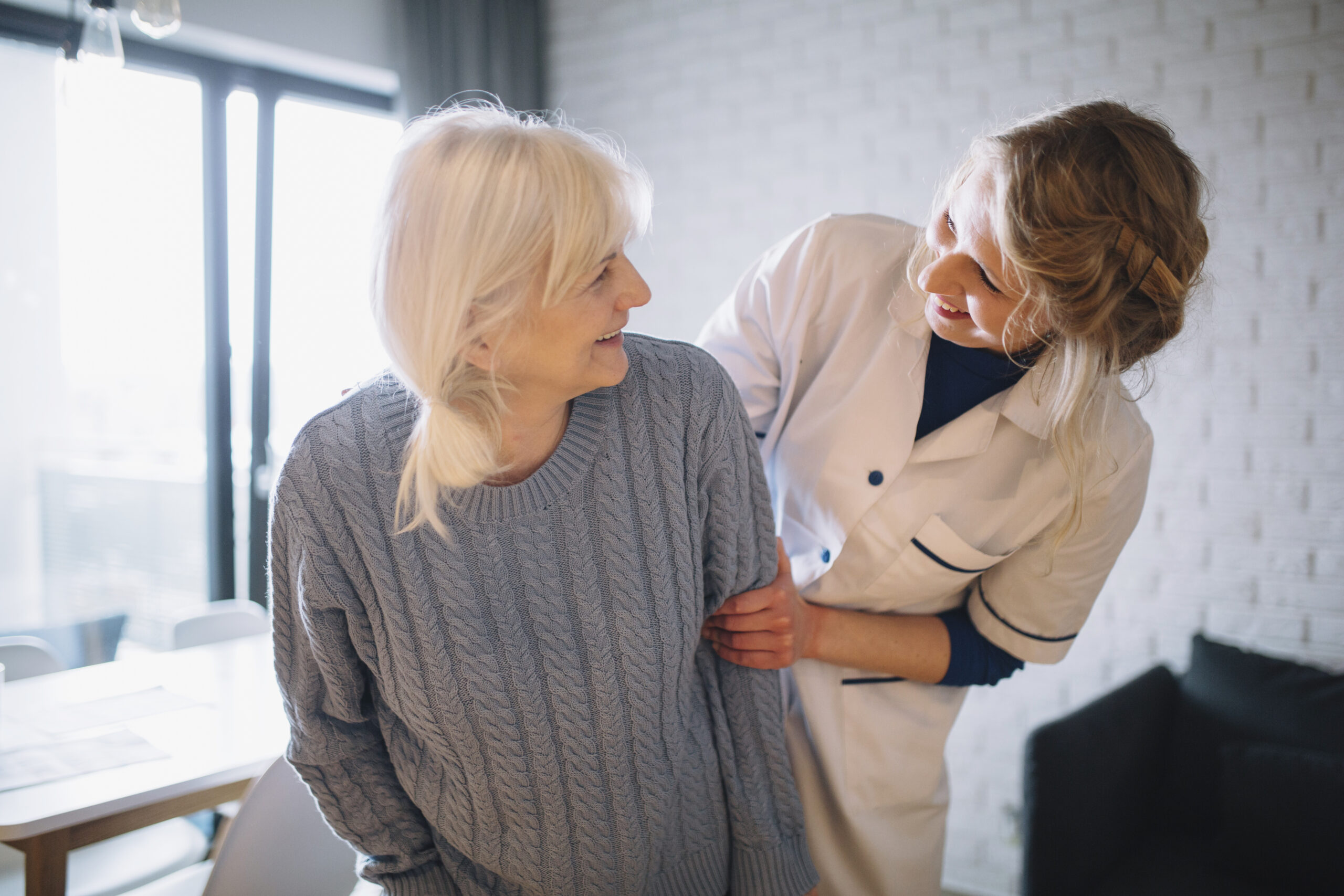 Support worker with residents in an aged care home