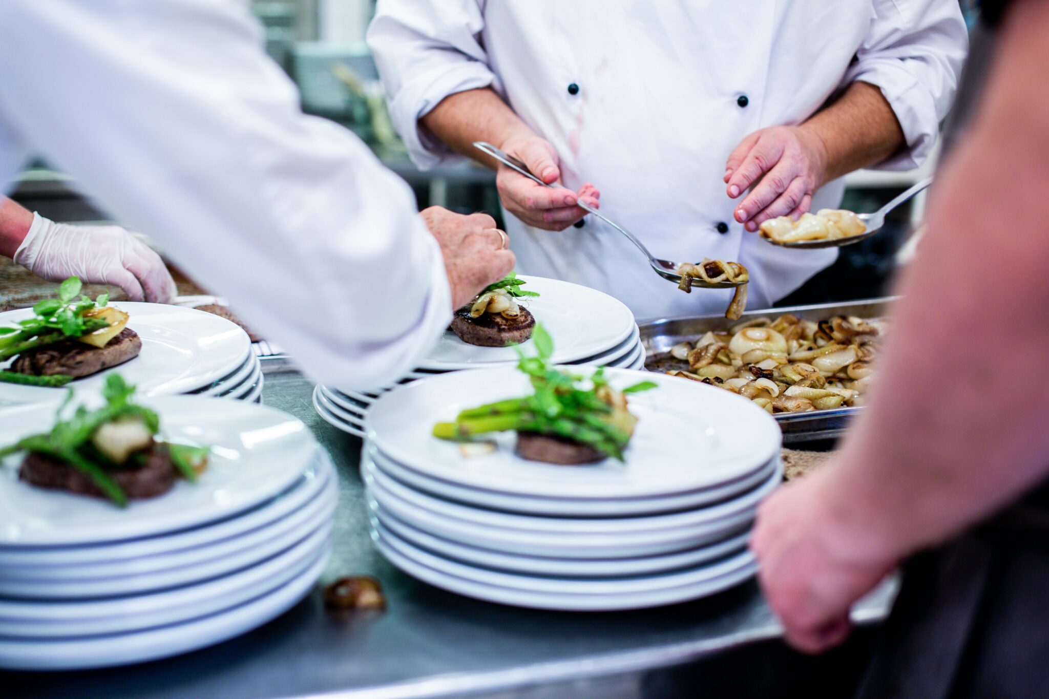 Cook preparing food in a professional kitchen