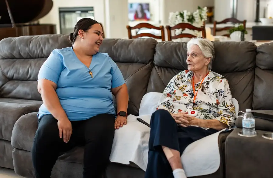Caregiver helping senior resident