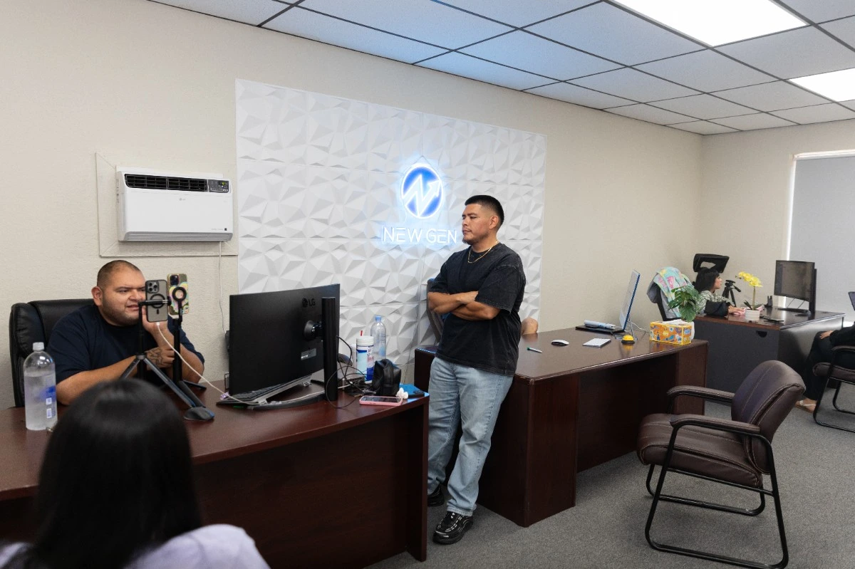 Josh Melara discussing financial education and wealth-building strategies with a client