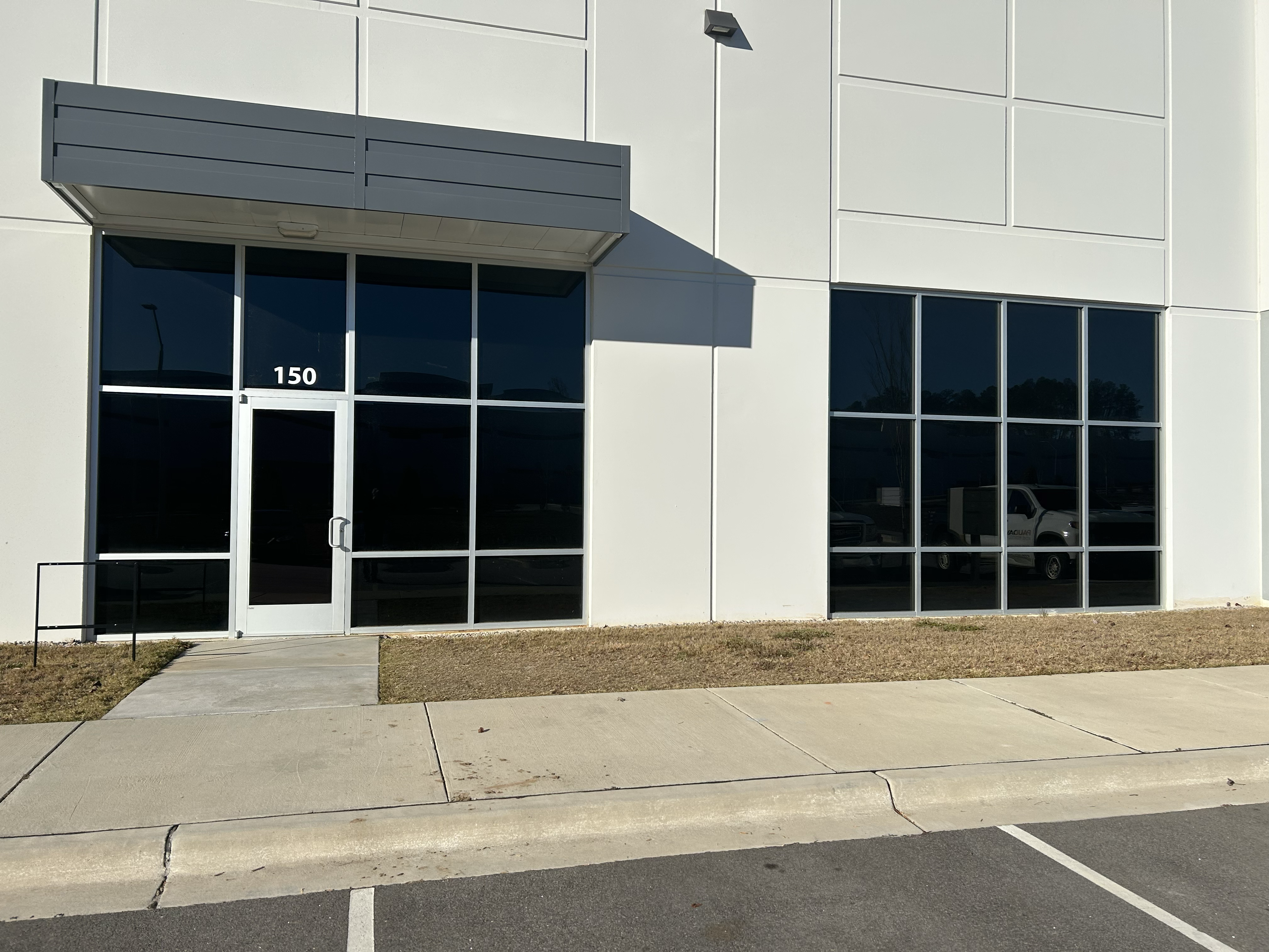 Tinted commercial building windows reducing heat in a Raleigh NC office