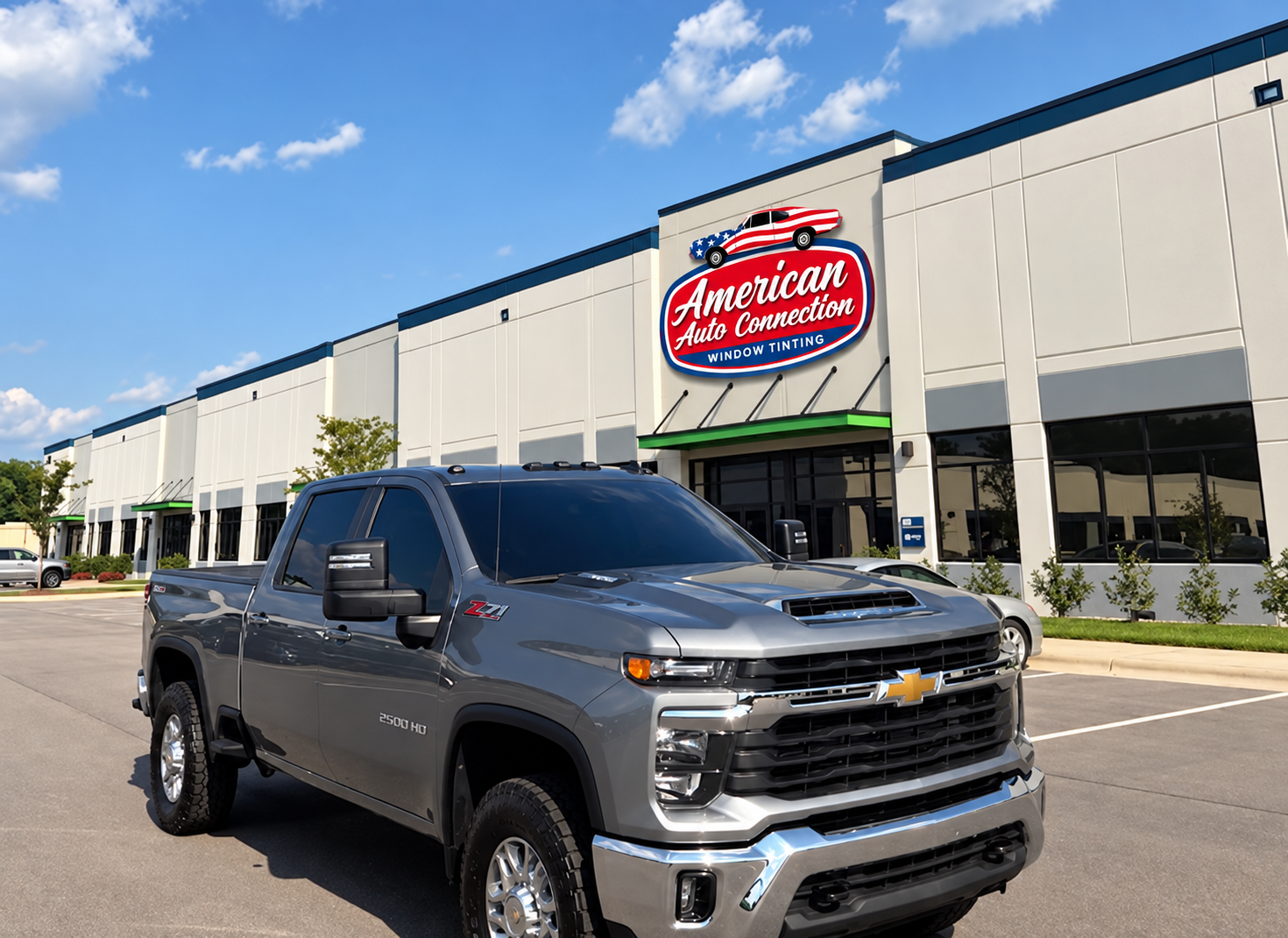 The American Auto Connection storefront on Veterans Parkway in Garner, North Carolina, with a freshly tinted Chevrolet Silverado parked out front