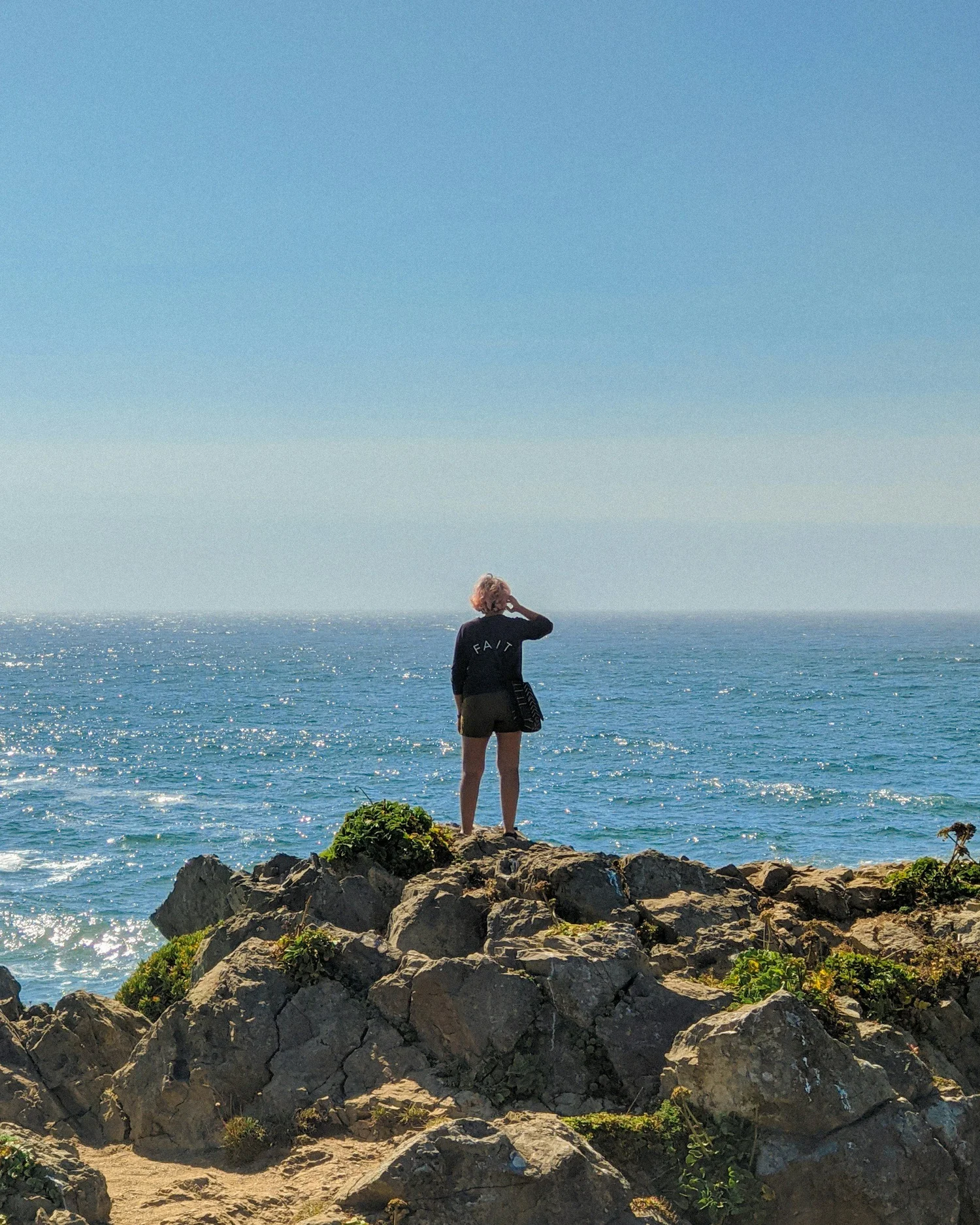 Person looking out over the ocean