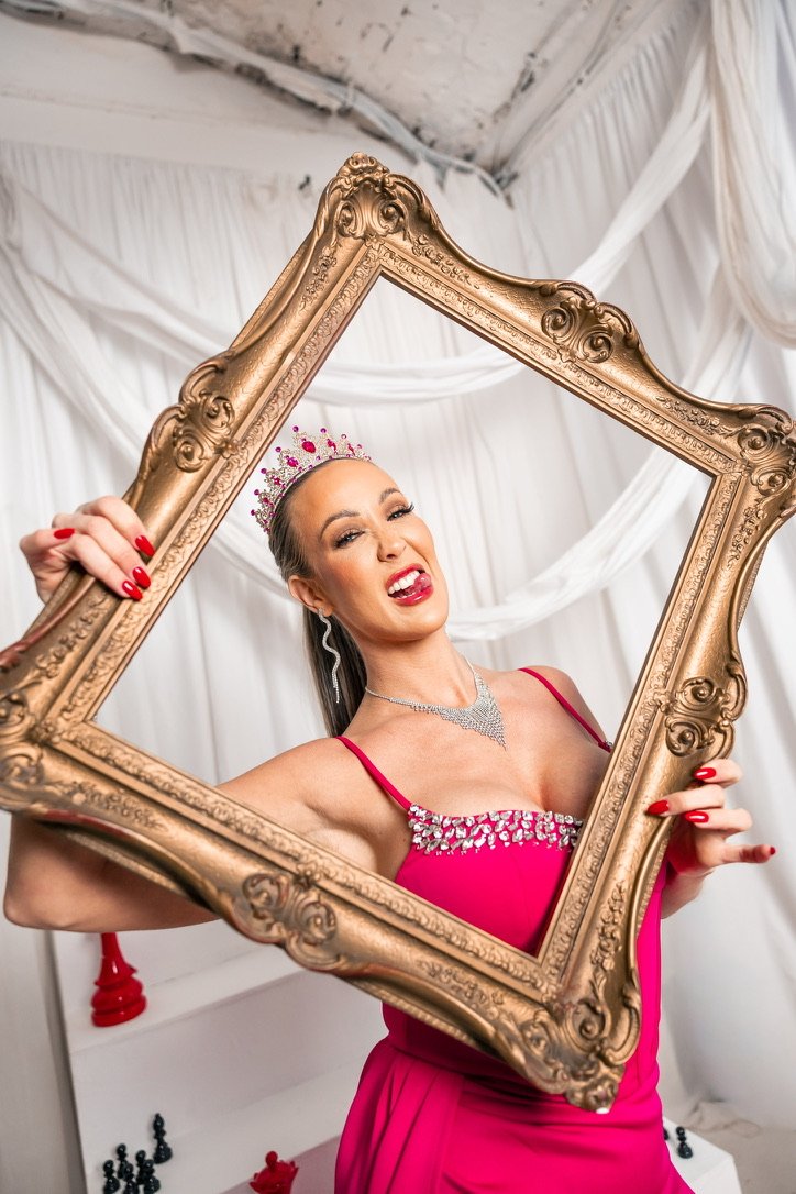 Nurse Kim holding a gold frame