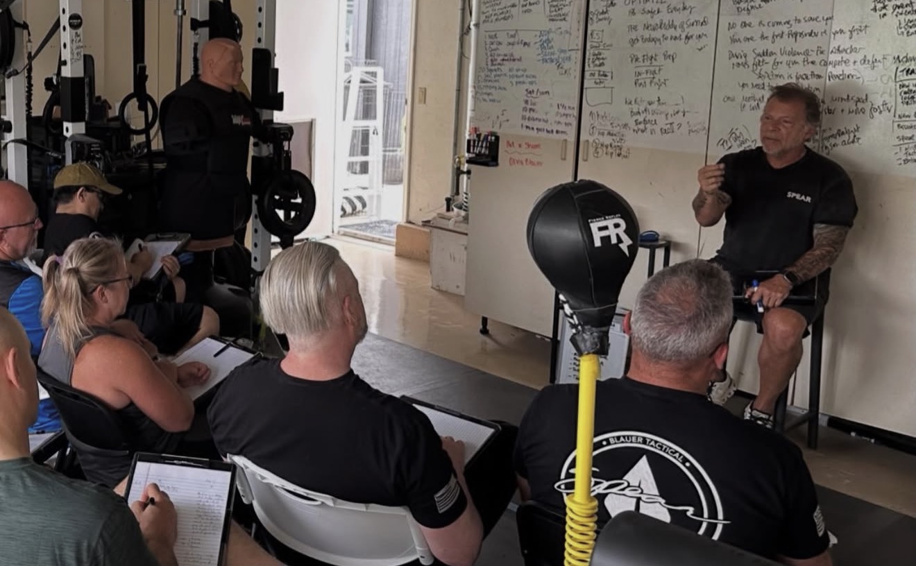 Coach Tony Blauer teaching in the classroom