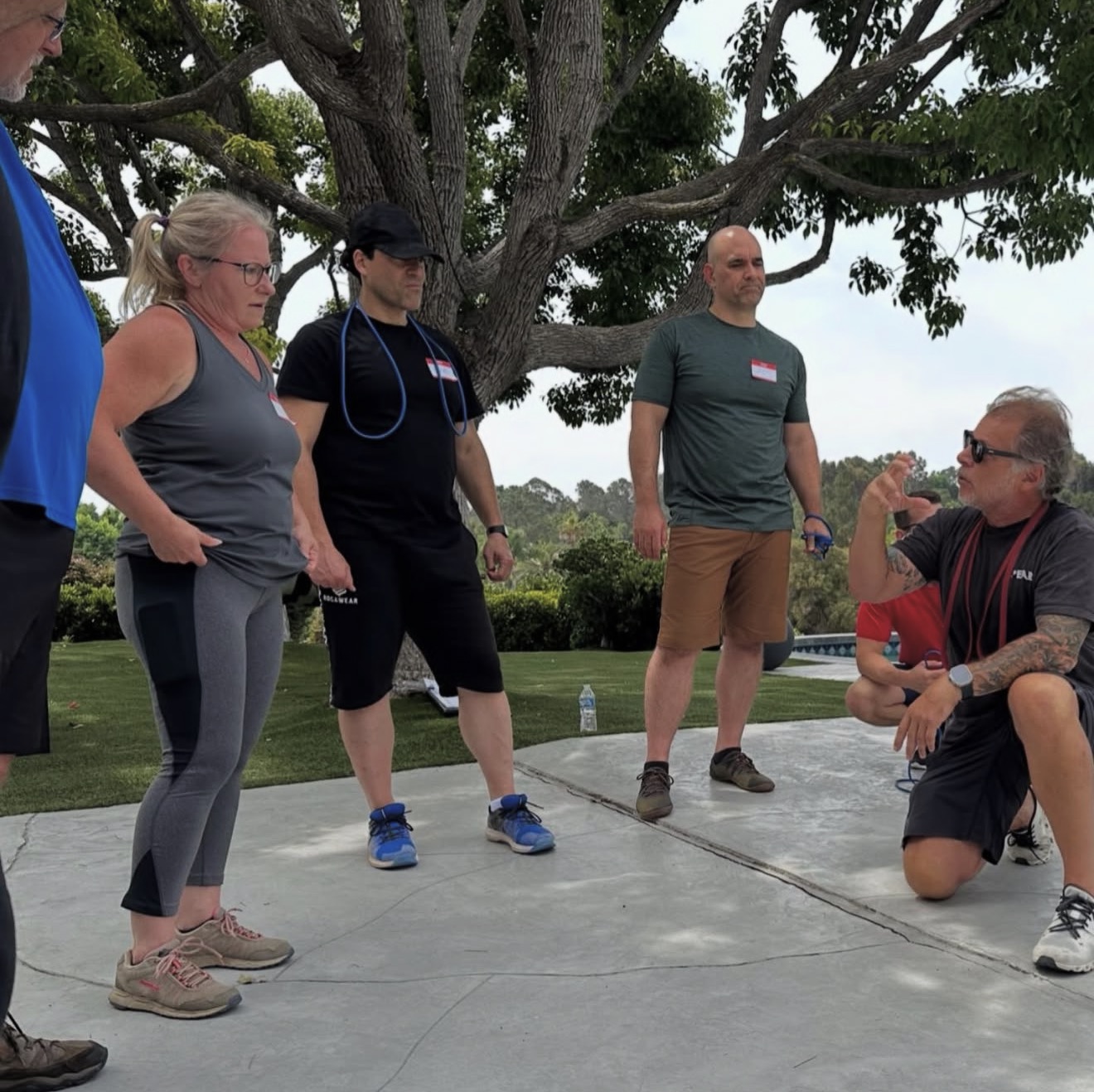 Coach Blauer coaching attendees outdoors