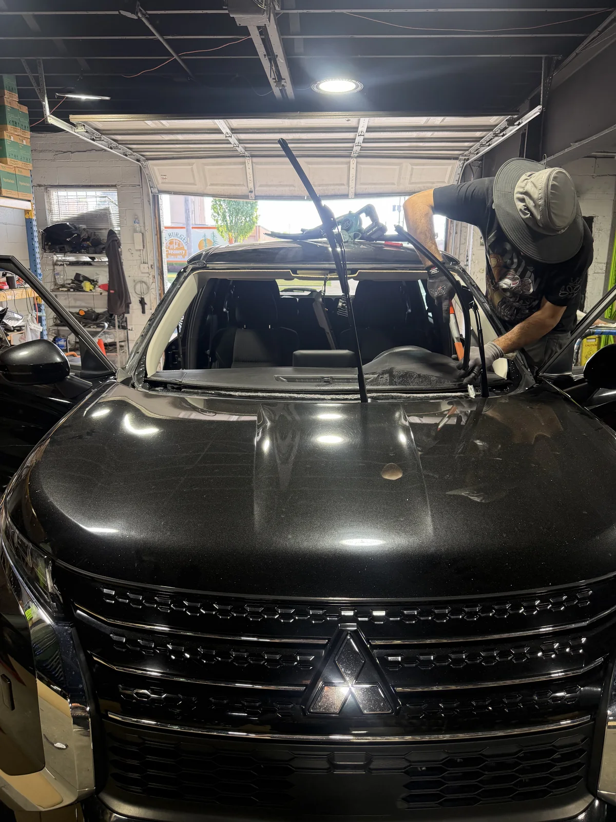 Windshield removed on the same Mitsubishi passenger SUV at AMJ