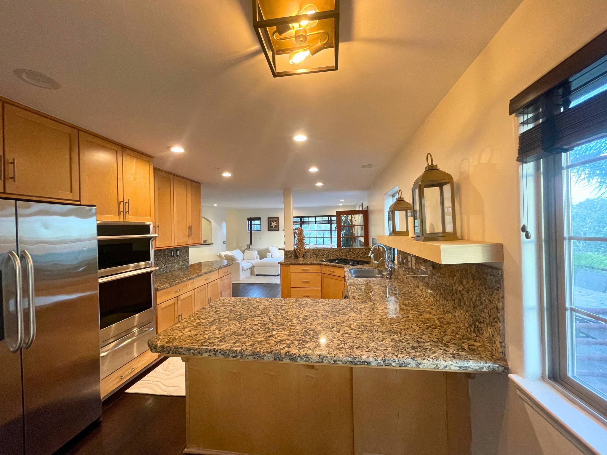 Great room with hand scraped bamboo flooring and consistent natural materials