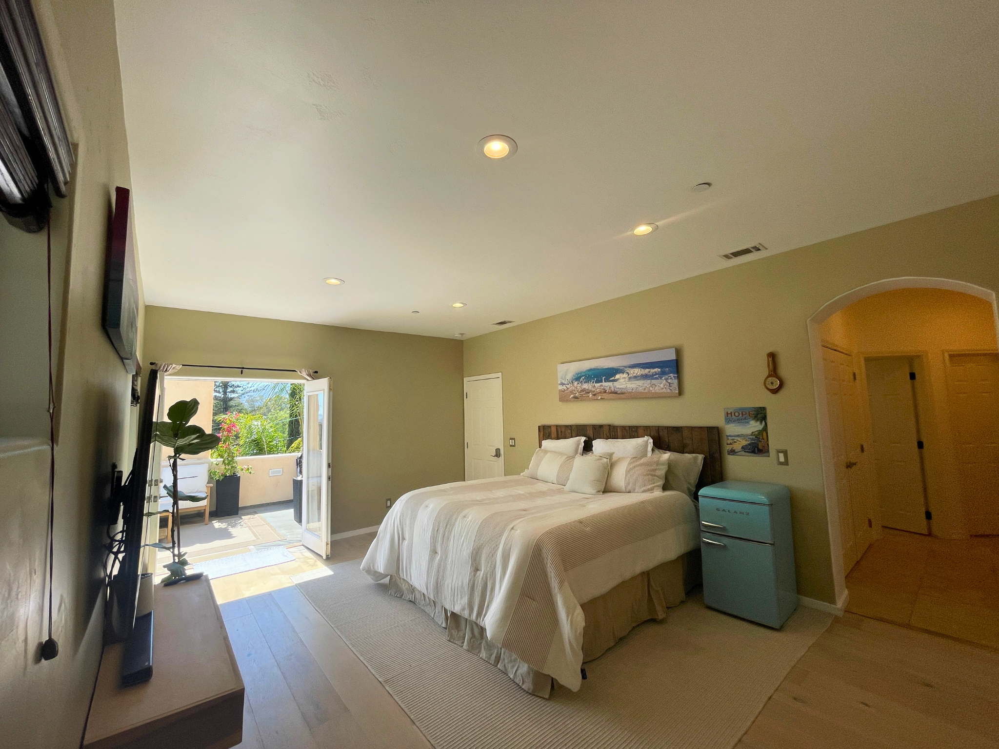 Skylit third floor hallway with custom woodwork opening to the hilltop garden