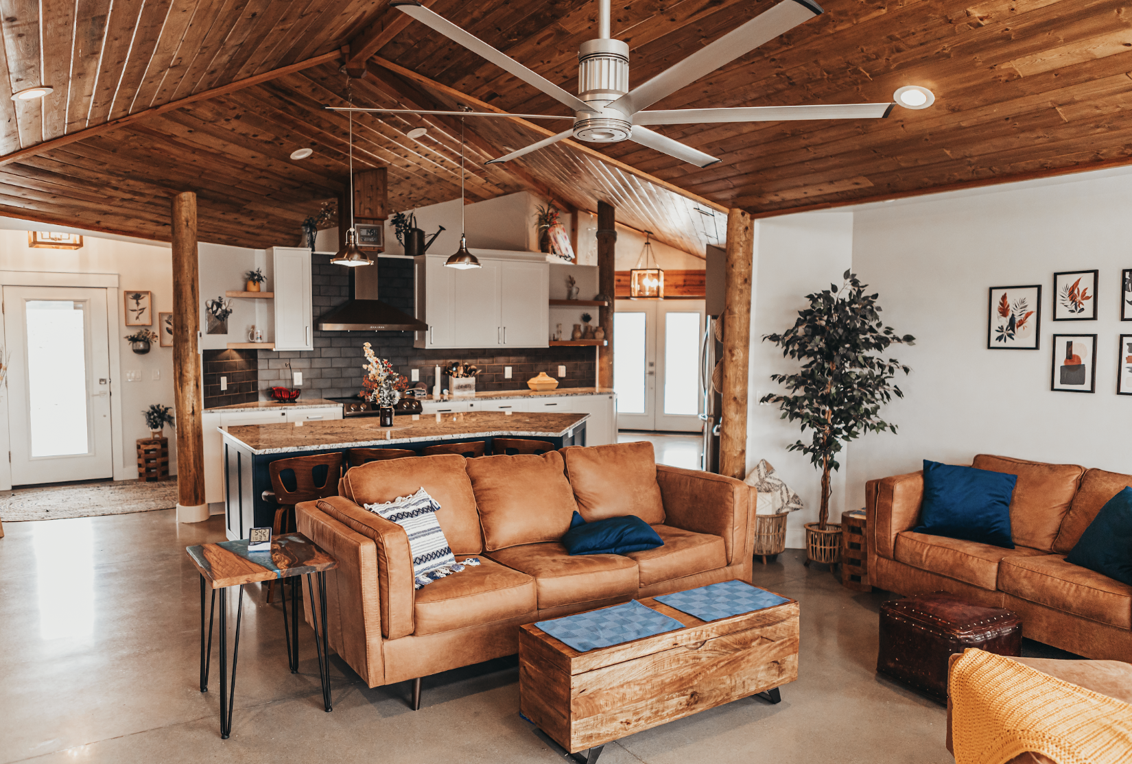  Open-plan living area in straw bale home with natural light and lime plaster walls in Idaho