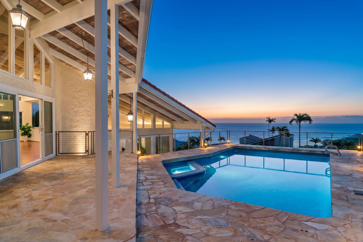 Living room with a wrap-around lanai and ocean views