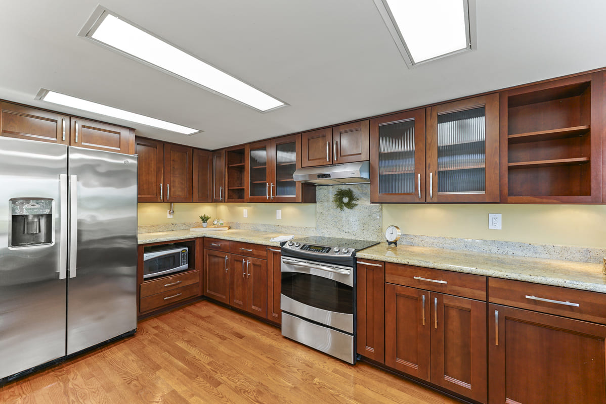 Primary suite with tall ceilings and recessed lighting