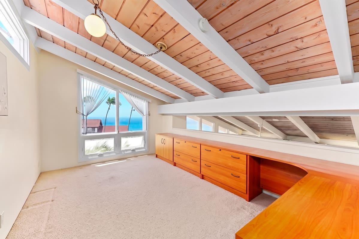 Main living area with surrounding ocean views from the front door