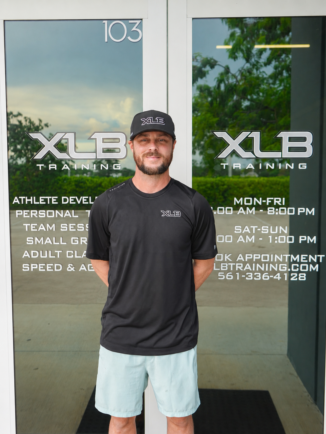 Ryan Lamb standing at the entrance to XLB Training in Boynton Beach, Florida