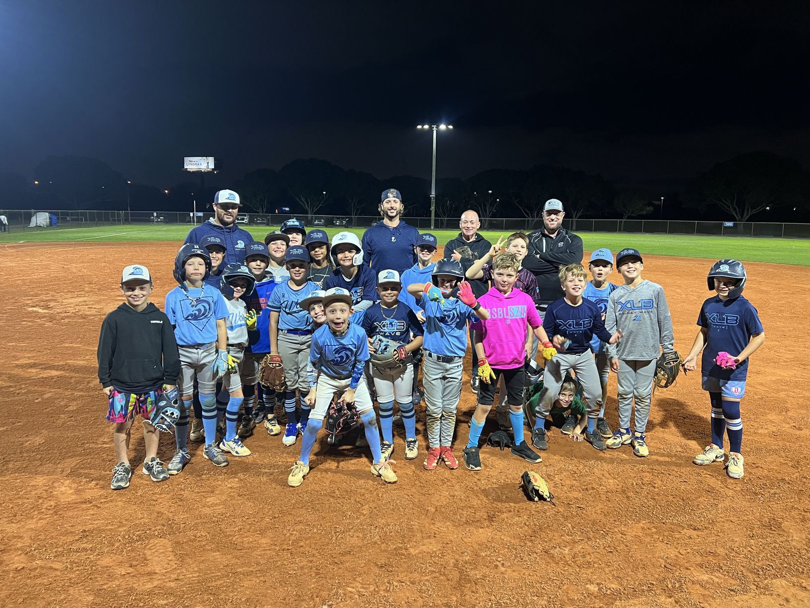 XLB Wave youth travel baseball players competing on the field in Palm Beach County, Florida