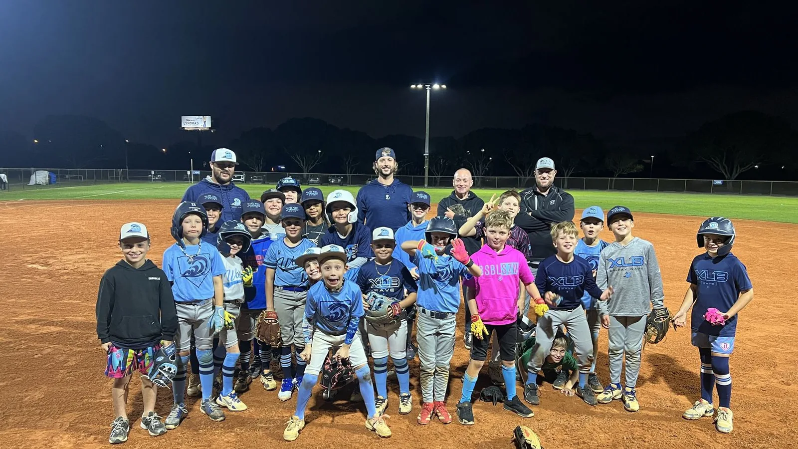 XLB Wave youth travel baseball players competing on the field in Palm Beach County, Florida
