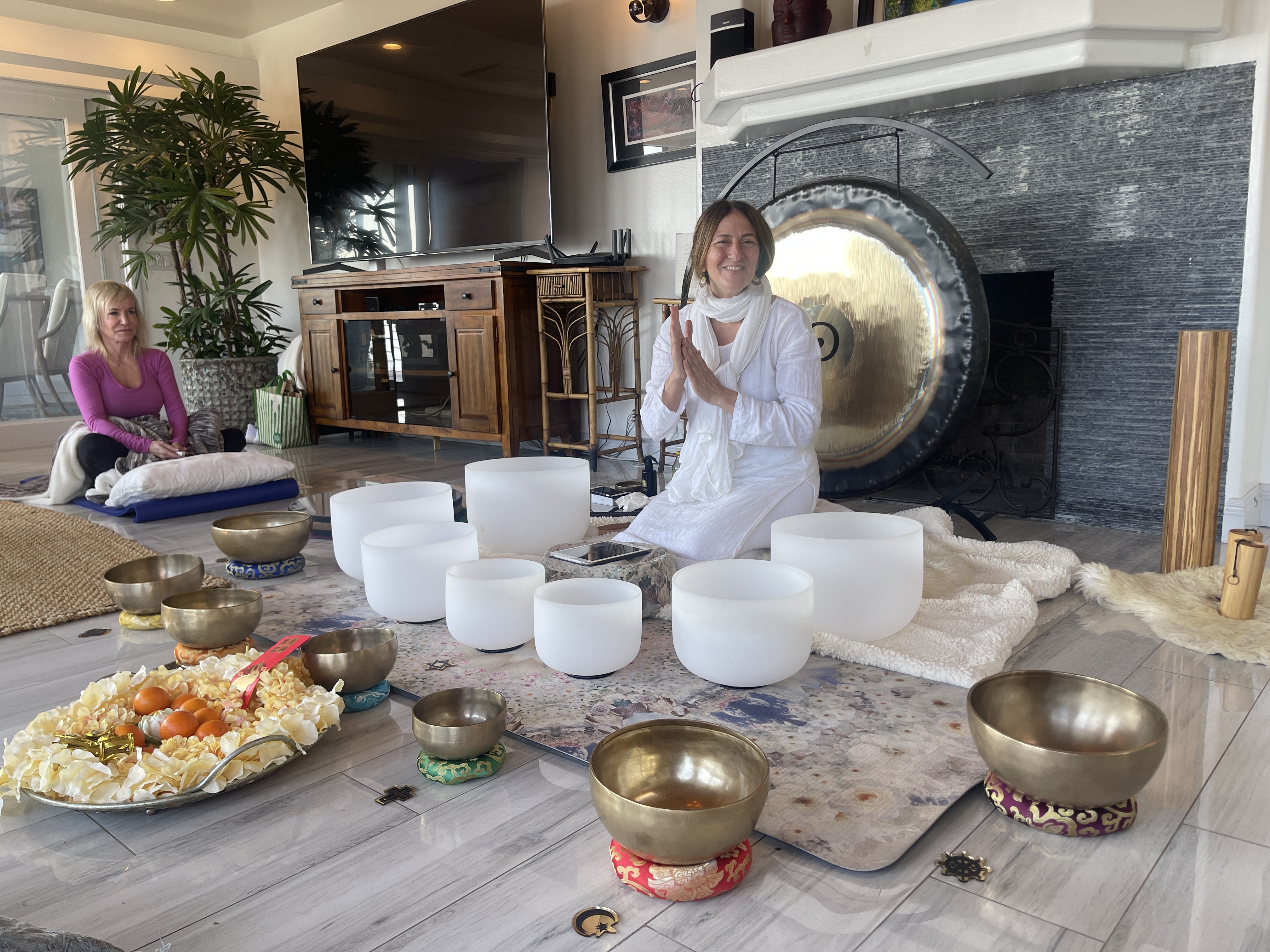 The circle gathered around the singing bowls