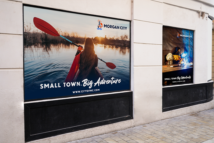 Morgan City brand applied to large-scale window displays with Big Adventure and Big Opportunity slogan variations visible