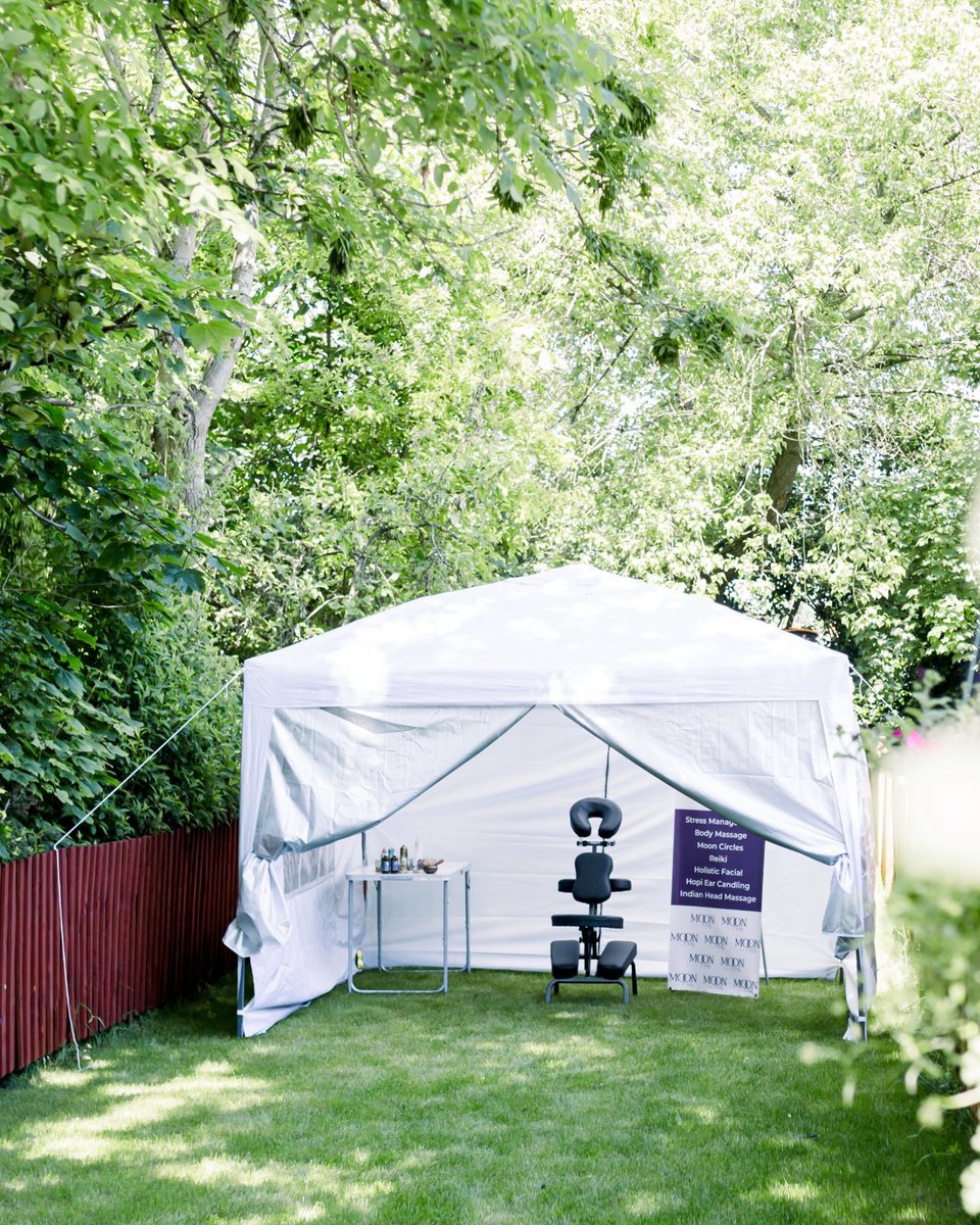 A Moon & Mars treatment gazebo set up in a garden