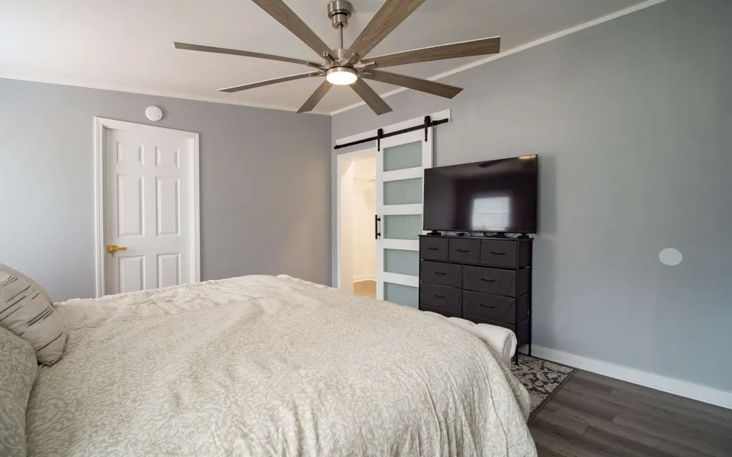 Bedroom at 1103 NW Moore Road with a barn door opening to the bathroom