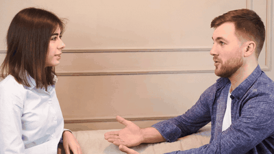 Two people in a thoughtful, measured conversation — having the talk that needed to happen