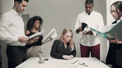 Leader at center of a team — everyone working in their own silo instead of together