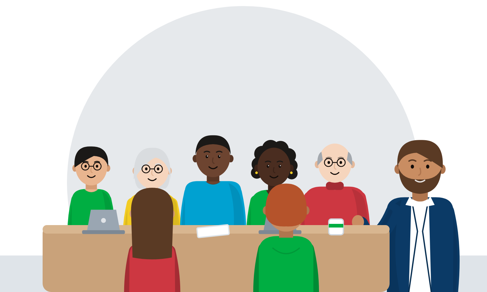 A team around a meeting table, each person working in a different way