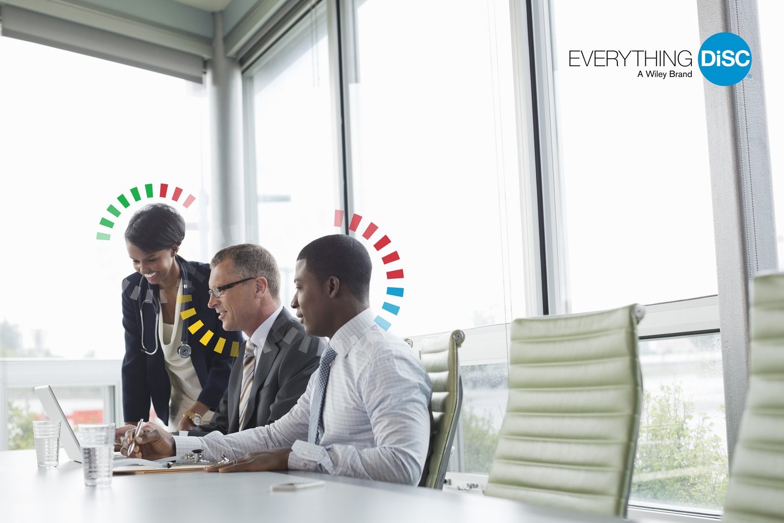 Three colleagues unite at the table, embodying teamwork and growth through the Everything DiSC Work of Leaders® framework for success.