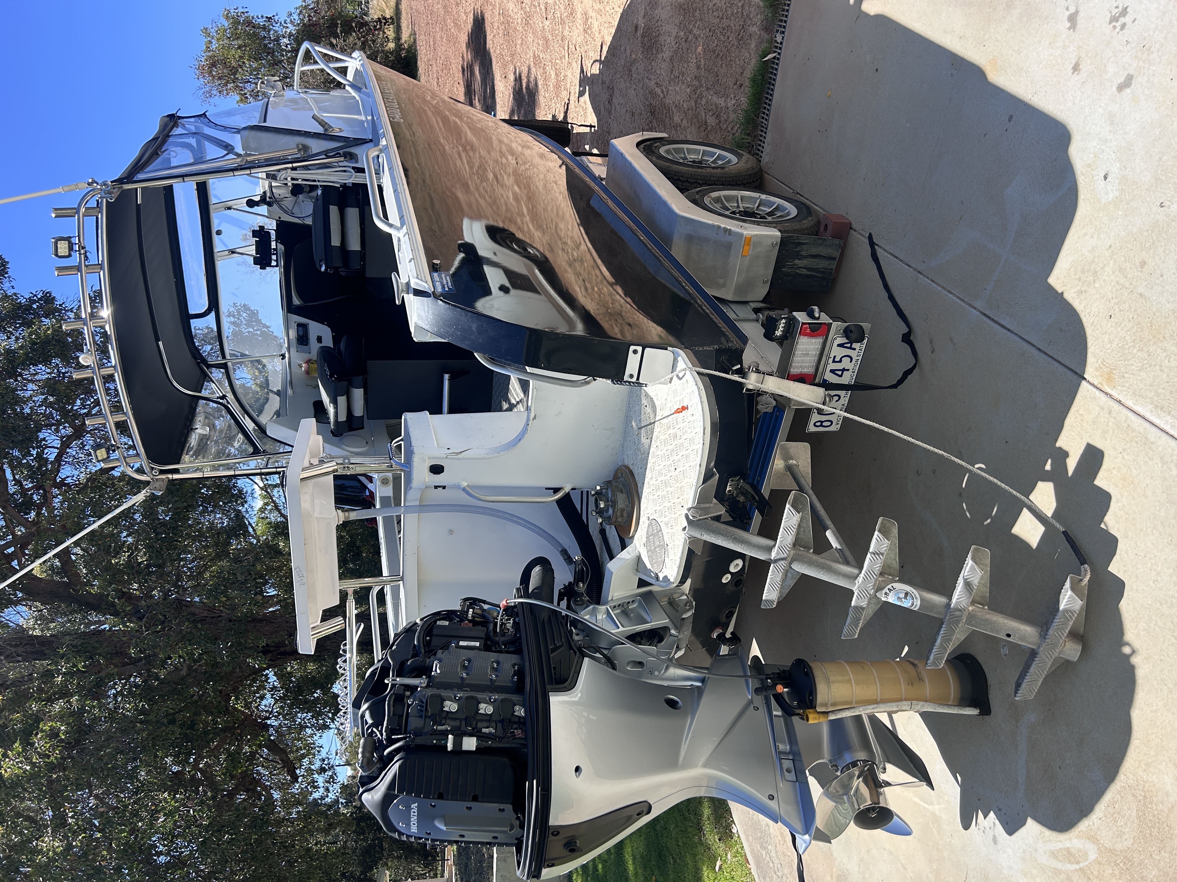 Mobile marine mechanic working on a boat engine