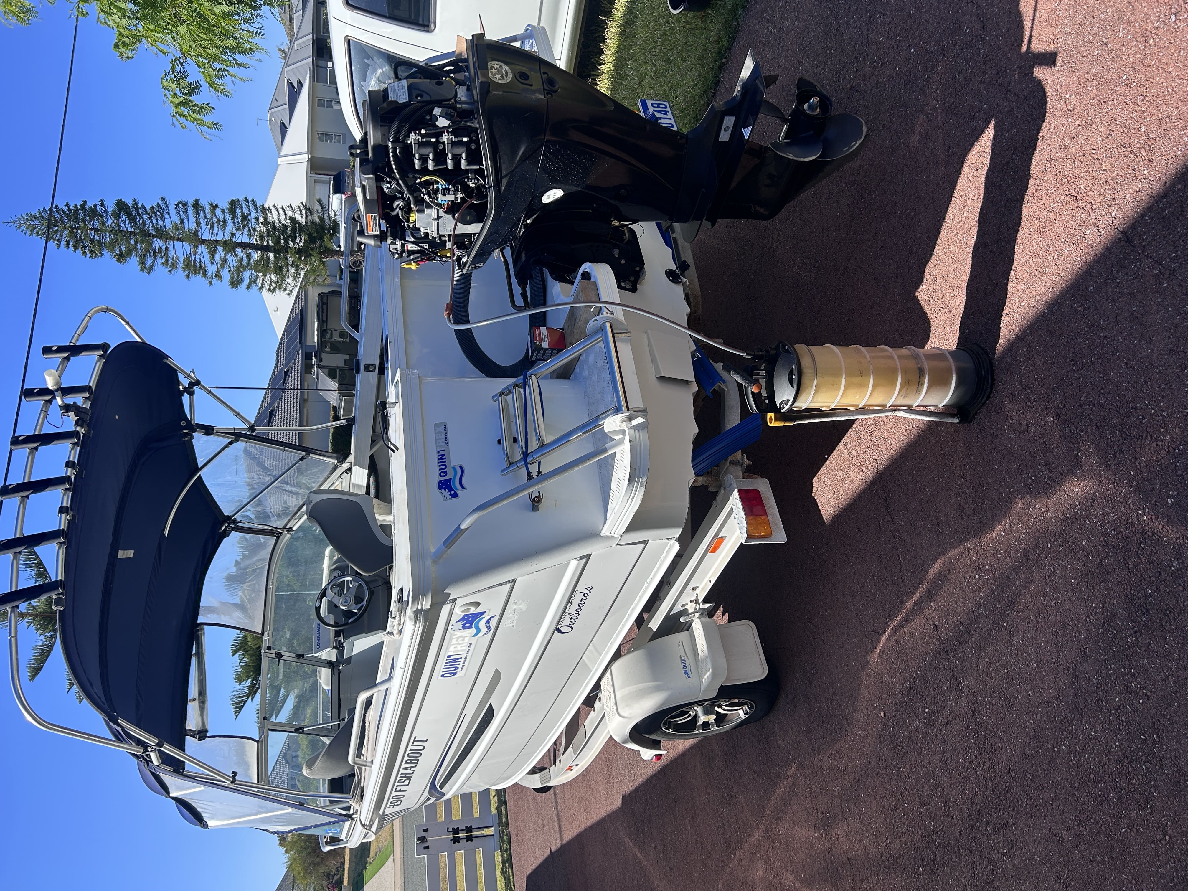 Outboard motor being serviced on site by a mobile marine mechanic