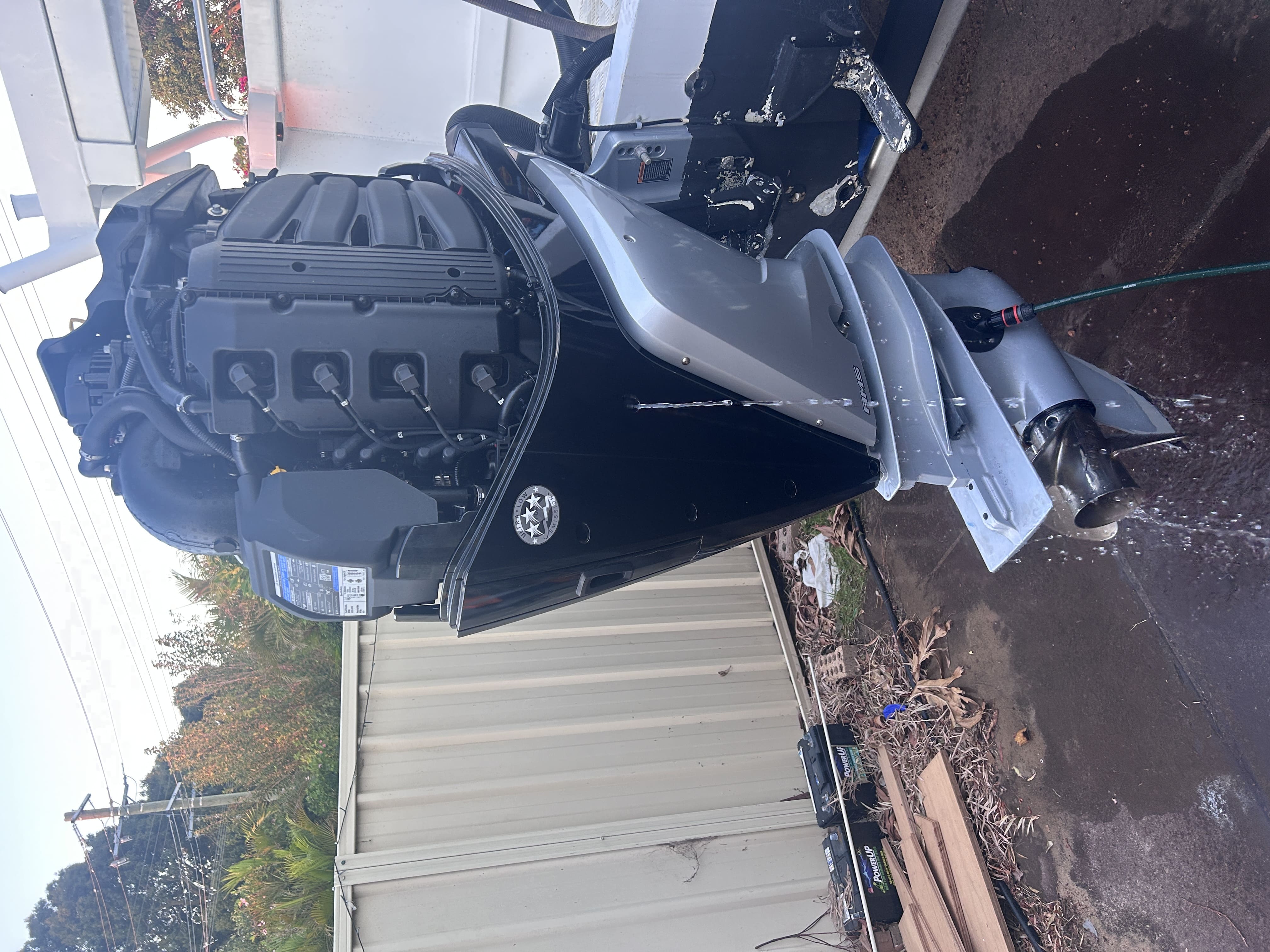Mobile marine mechanic servicing an outboard motor
