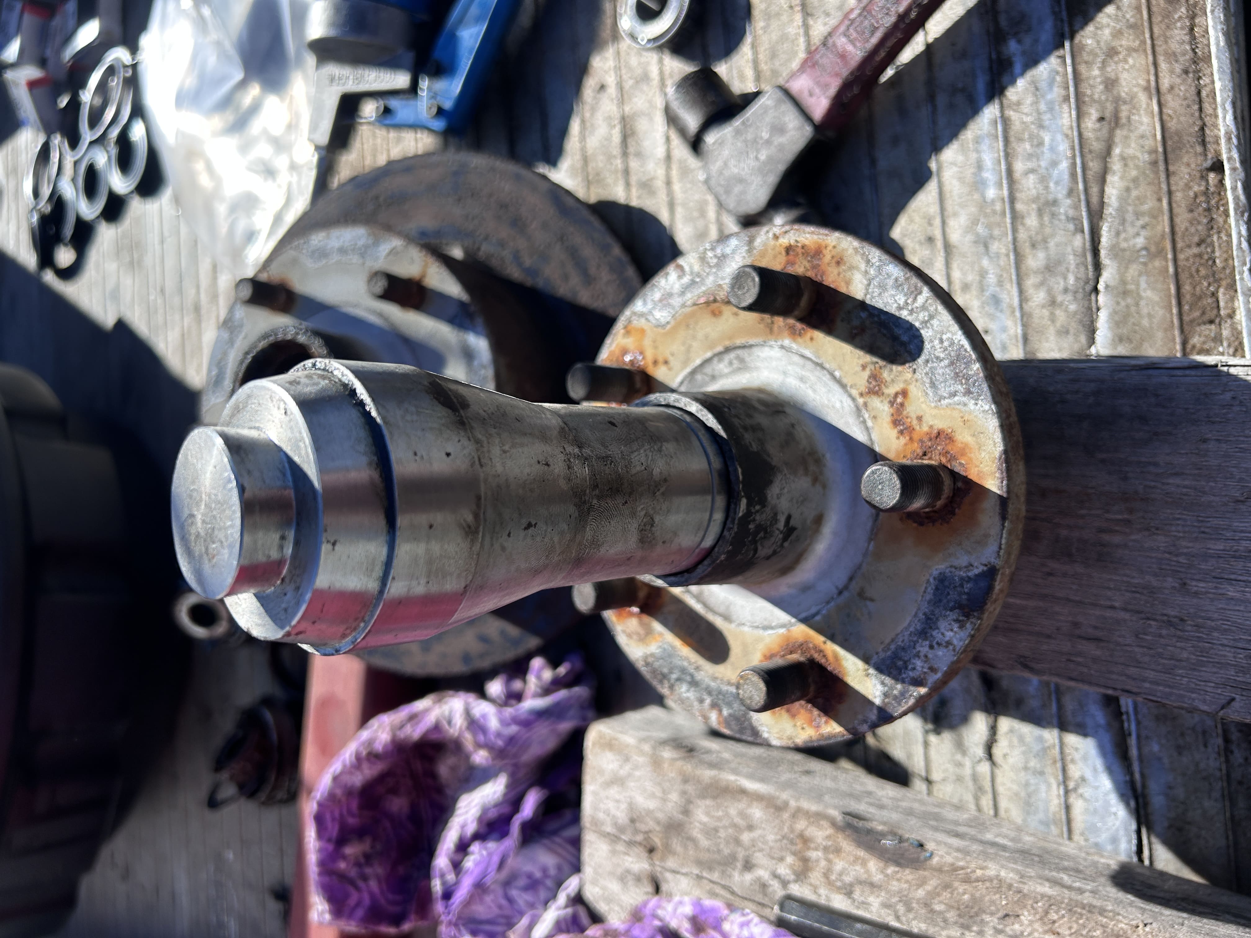 Marine mechanic working on a boat engine on site