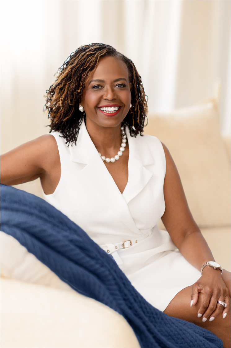 Glynnis Day Thatch, NP, smiling in a white outfit.